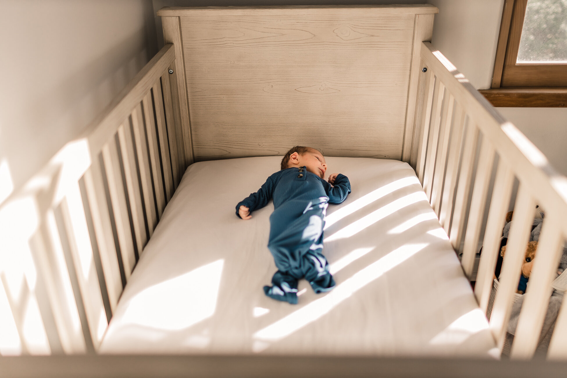 Newborn in his crib